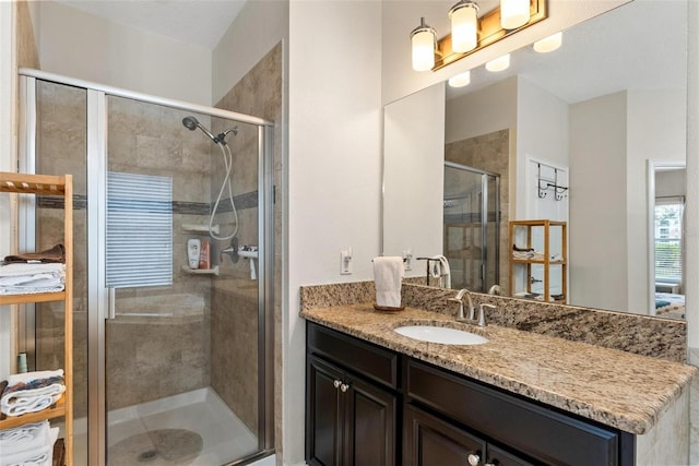 full bathroom featuring a shower stall and vanity