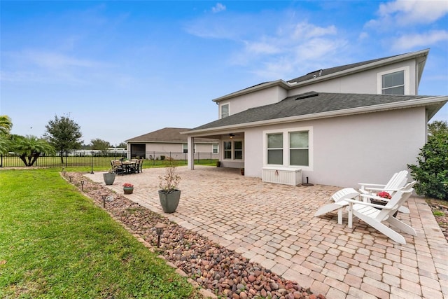 back of house featuring stucco siding and a patio