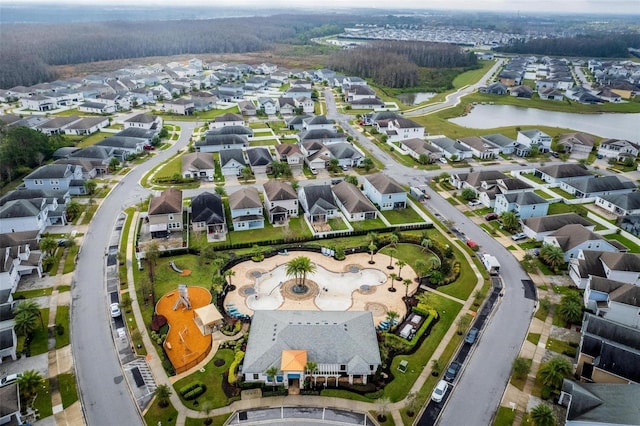 aerial perspective of suburban area featuring a nearby body of water