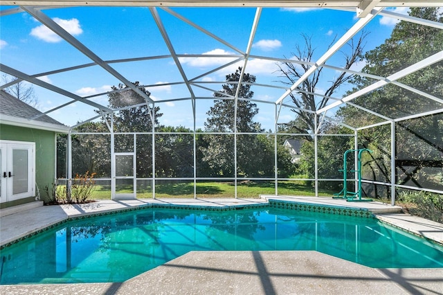 outdoor pool featuring french doors, a patio, and a lanai