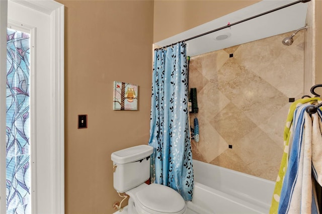 full bath featuring shower / bath combo with shower curtain and toilet