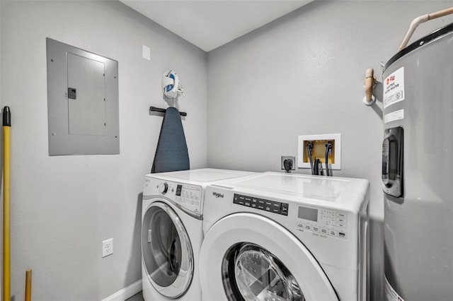 washroom with laundry area, baseboards, water heater, independent washer and dryer, and electric panel