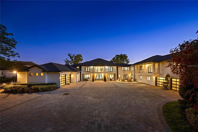 3120 Downs Cove Rd, Windermere, FL 34786 - view of front of home with decorative driveway, stucco siding, an attached garage, and french doors