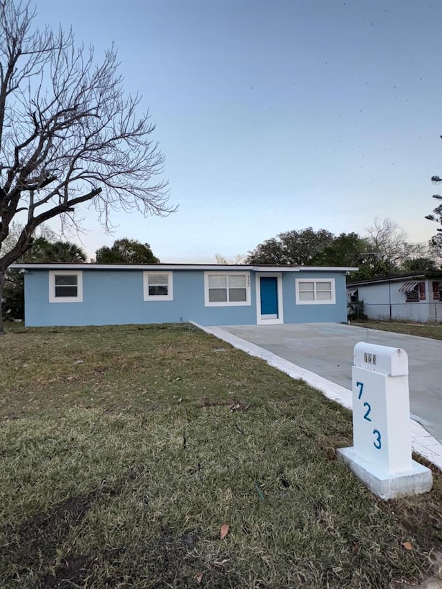 723 Fairmount Rd, Daytona Beach, FL 32114 - ranch-style house featuring stucco siding and a front yard