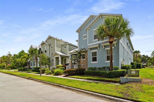 view of front of home featuring a front lawn and stucco siding