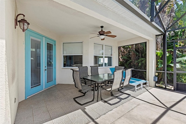 sunroom / solarium with french doors and ceiling fan