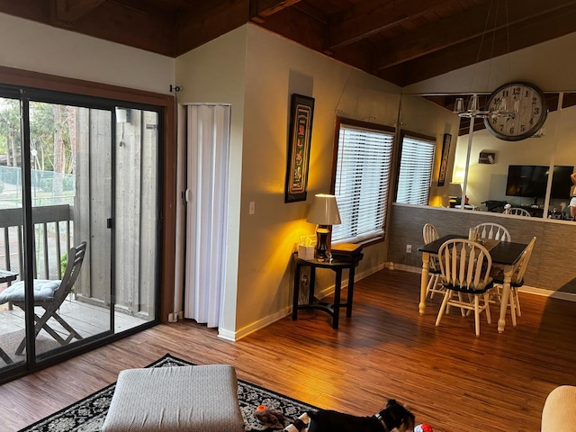 living room with vaulted ceiling with beams, baseboards, and wood finished floors