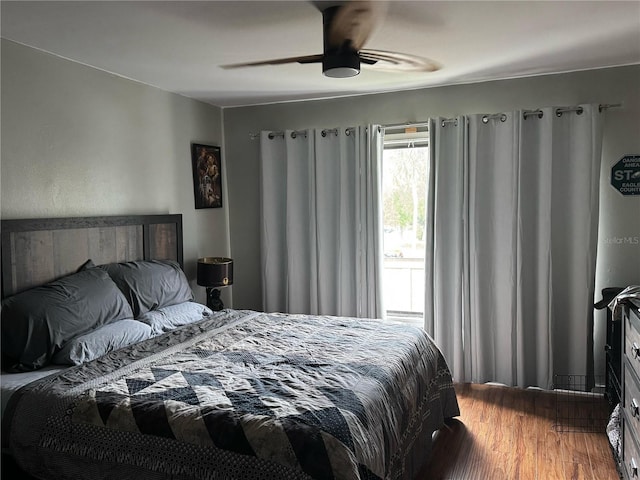 bedroom featuring a ceiling fan and wood finished floors