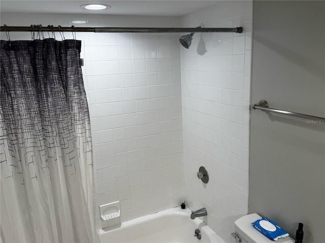 full bathroom with shower / bath combination with curtain and toilet