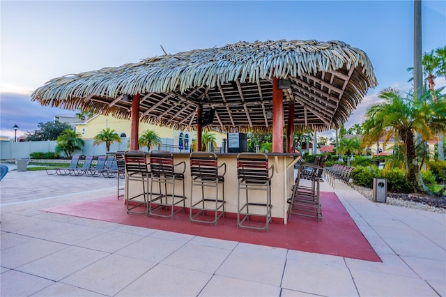 view of patio / terrace with fence and outdoor dry bar