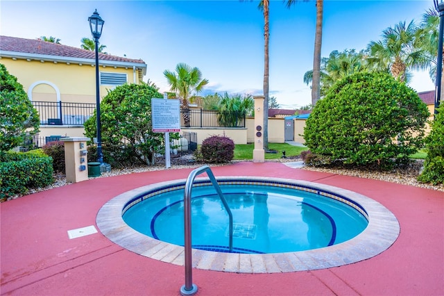 view of swimming pool featuring a community hot tub