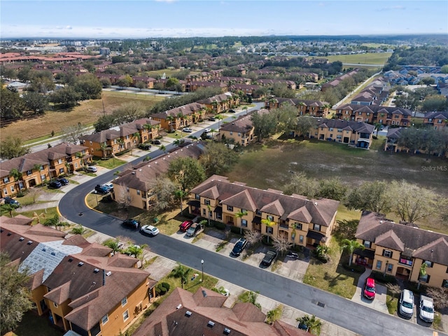 birds eye view of property with a residential view