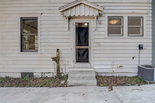 doorway to property with crawl space and central air condition unit