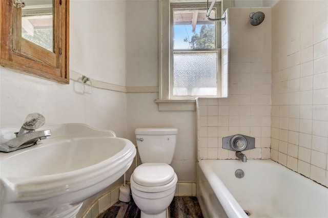 full bathroom featuring toilet and a sink