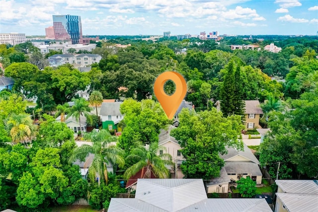 birds eye view of property featuring a city view