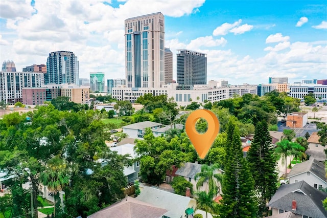 birds eye view of property with a view of city