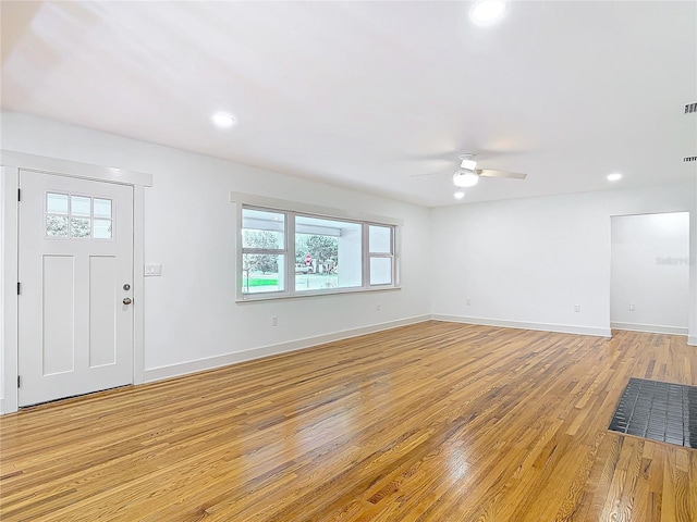 interior space with baseboards, recessed lighting, a ceiling fan, and light wood-style floors