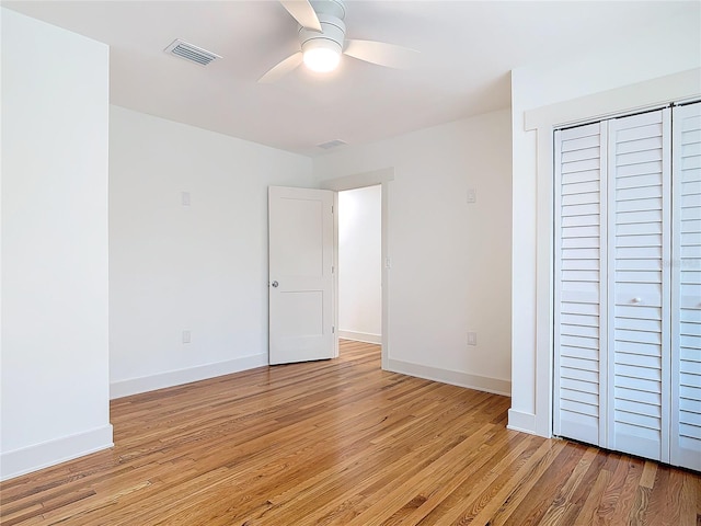 unfurnished bedroom featuring light wood-type flooring, baseboards, and visible vents