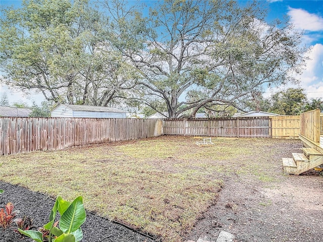 view of yard with a fenced backyard