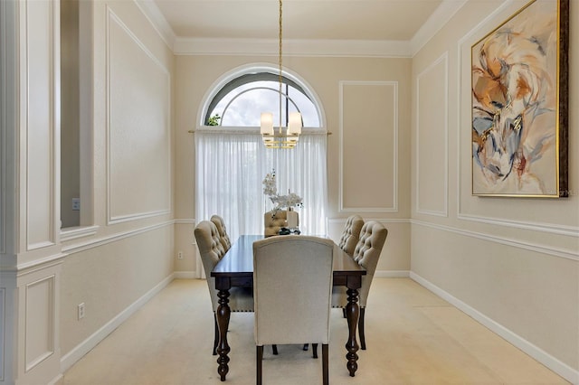 dining space featuring an inviting chandelier, baseboards, ornamental molding, and carpet flooring