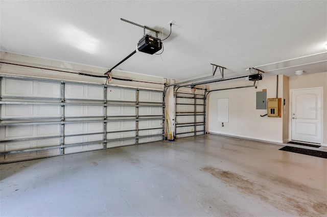 garage featuring a garage door opener and electric panel