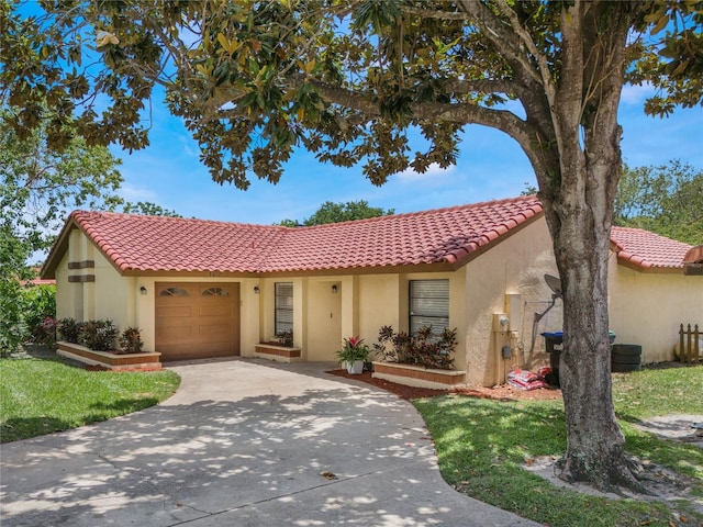 mediterranean / spanish home featuring an attached garage, a tile roof, concrete driveway, and stucco siding