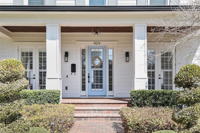 doorway to property featuring a porch