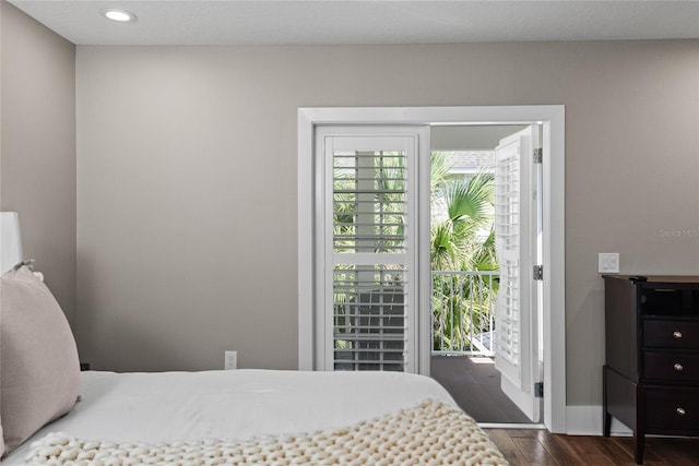 bedroom with dark wood-style floors, baseboards, and recessed lighting