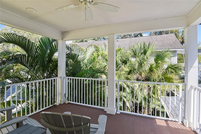 wooden terrace featuring ceiling fan