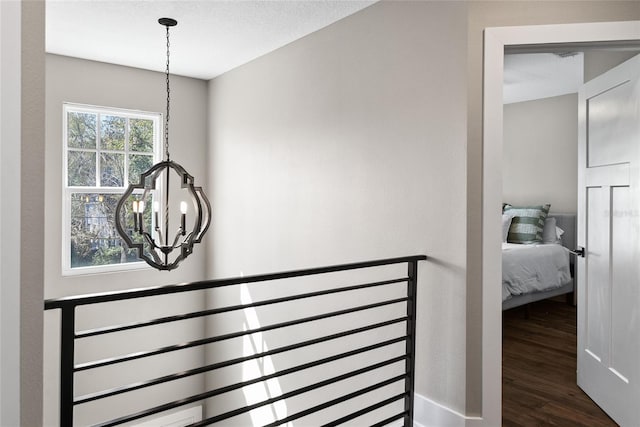 interior space featuring a notable chandelier and wood finished floors