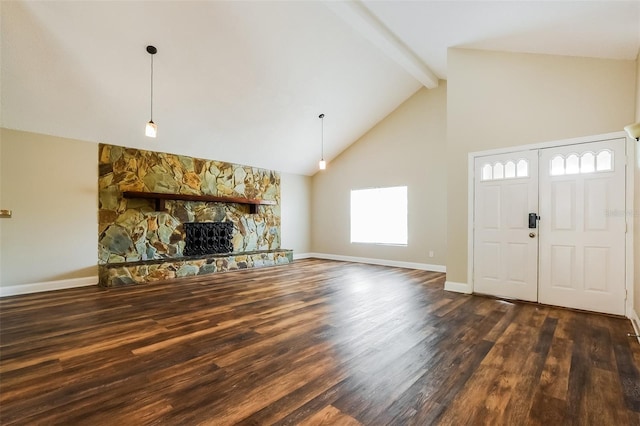 unfurnished living room featuring high vaulted ceiling, dark wood-type flooring, a fireplace, baseboards, and beam ceiling