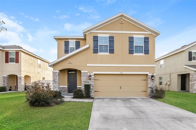 view of front of home featuring a front lawn, concrete driveway, and stucco siding