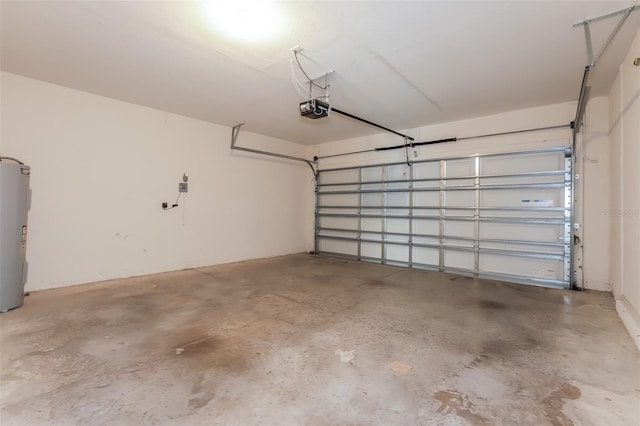 garage with electric water heater and a garage door opener