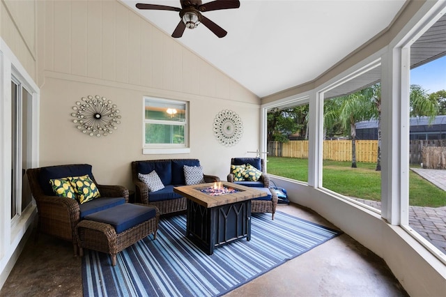 sunroom / solarium featuring lofted ceiling and ceiling fan