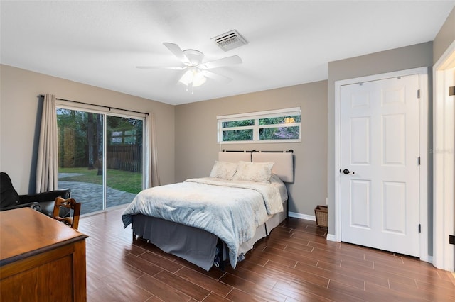 bedroom featuring visible vents, ceiling fan, baseboards, wood finish floors, and access to outside