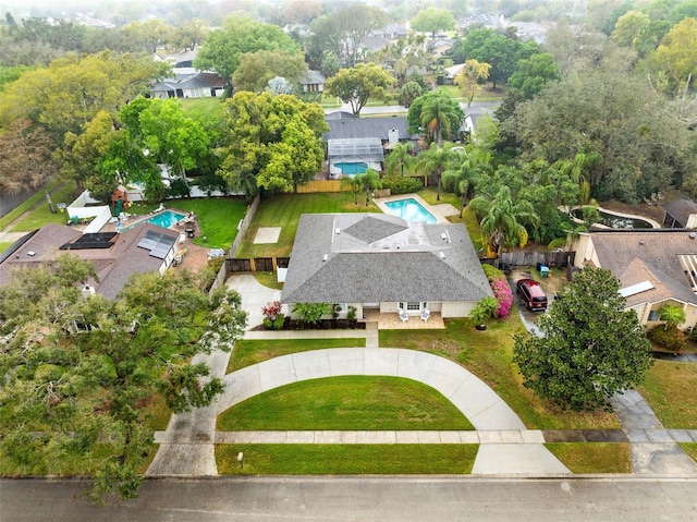 birds eye view of property with a residential view