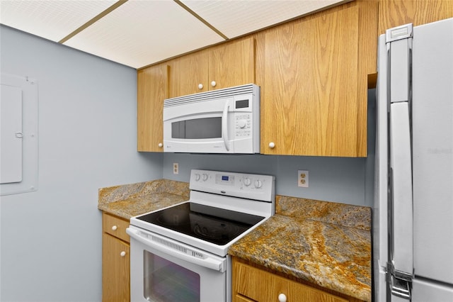 kitchen with brown cabinetry and white appliances