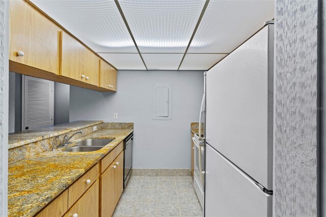 2297 Burnway Rd Unit 2297, Haines City, FL 33844 - kitchen featuring electric range oven, dishwashing machine, freestanding refrigerator, light stone countertops, and a sink