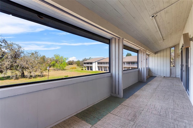 2297 Burnway Rd Unit 2297, Haines City, FL 33844 - unfurnished sunroom with lofted ceiling and wood ceiling