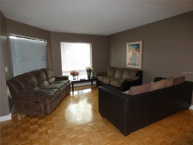4340 Lakeway Dr Unit H, Orlando, FL 32839 - living area featuring a textured ceiling and baseboards
