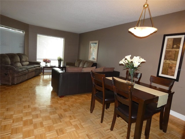 4340 Lakeway Dr Unit H, Orlando, FL 32839 - dining space with a textured ceiling and baseboards