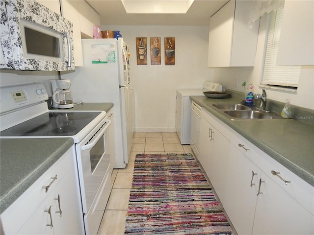 4340 Lakeway Dr Unit H, Orlando, FL 32839 - kitchen featuring white appliances, dark countertops, a sink, and white cabinets