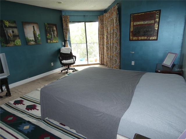 4340 Lakeway Dr Unit H, Orlando, FL 32839 - carpeted bedroom with a textured ceiling and baseboards