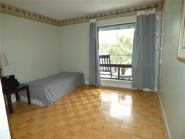 4340 Lakeway Dr Unit H, Orlando, FL 32839 - unfurnished bedroom featuring multiple windows and baseboards