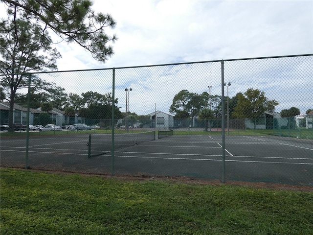 4340 Lakeway Dr Unit H, Orlando, FL 32839 - view of tennis court featuring fence and a yard