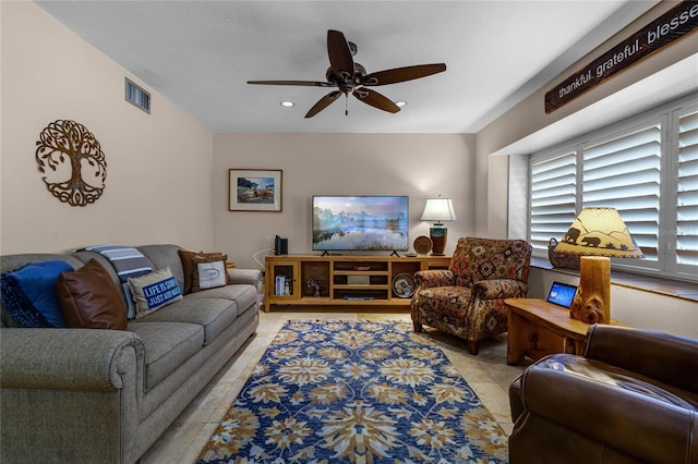 living area with light tile patterned floors, ceiling fan, visible vents, and recessed lighting