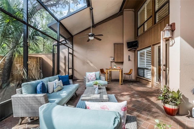 view of patio / terrace with a lanai, outdoor lounge area, and a ceiling fan