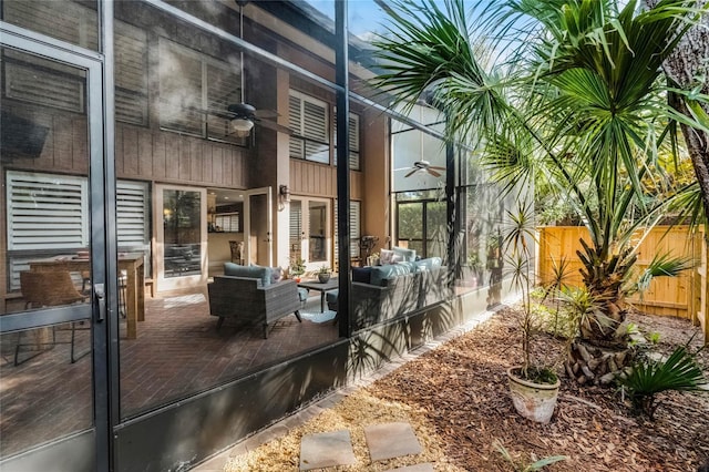 view of patio / terrace featuring ceiling fan, an outdoor hangout area, and fence