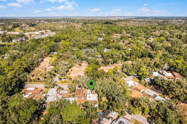 bird's eye view featuring a wooded view