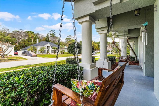 view of patio featuring a residential view and covered porch